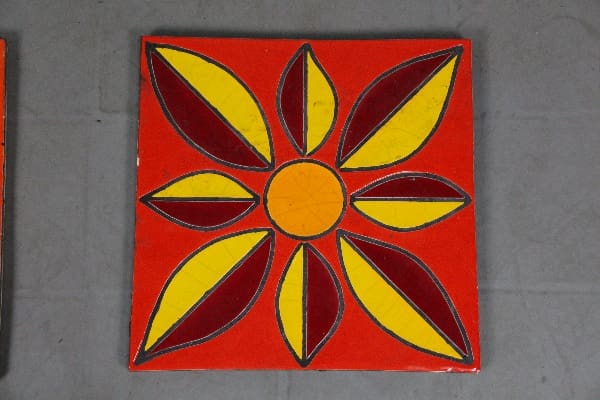 Red tile with yellow and maroon flower