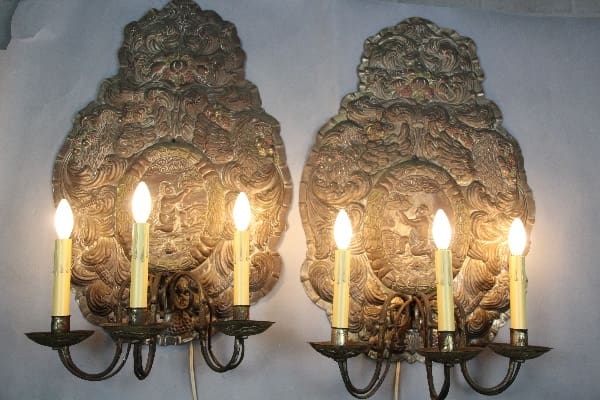 Ornate candle wall sconces with lights.