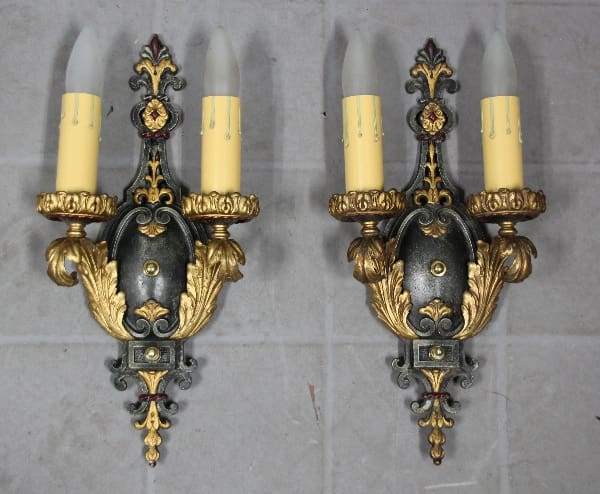 Vintage wall sconces with ornate designs.
