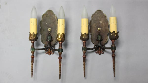 Vintage wall sconces with candle-style lights.