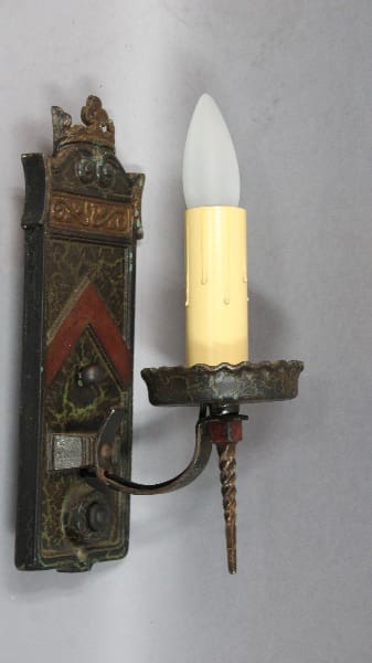 Antique wall sconce with candle holder.