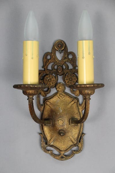 Vintage wall sconce with two candle lights.