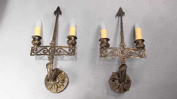 Vintage wall sconces with candle-shaped lights.