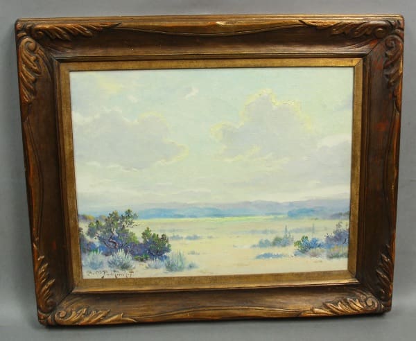 Landscape painting in ornate wooden frame.
