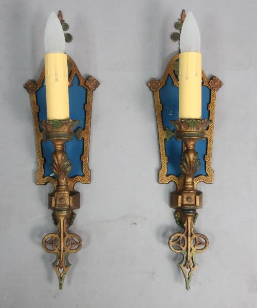 Vintage wall sconces with yellow candles.