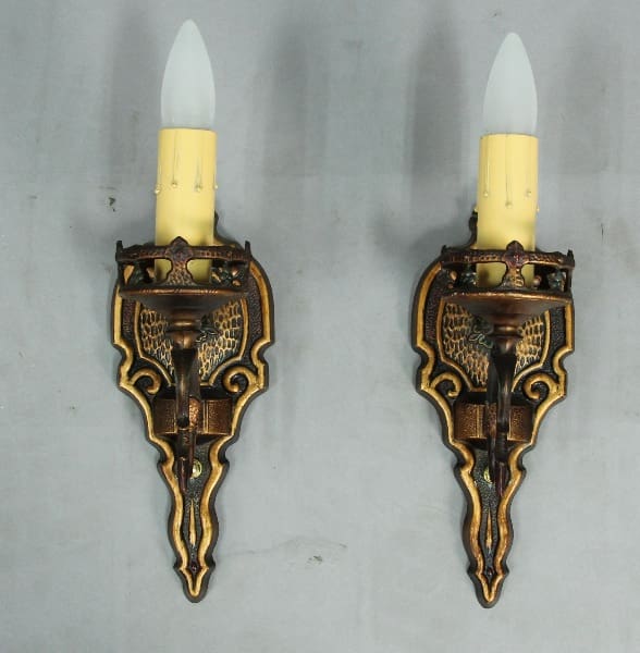 Vintage wall sconces with candle-style bulbs.