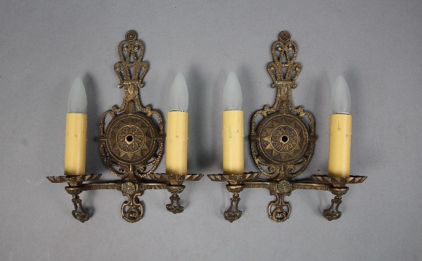Vintage wall sconces with candle-shaped bulbs.