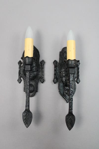 Vintage wall sconces with candle-like bulbs.