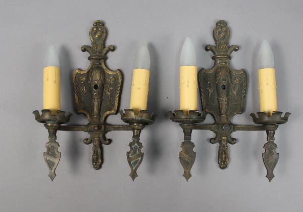 Vintage wall sconces with candle-like bulbs.