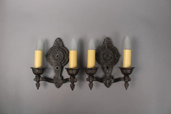 Vintage wall sconce with candle-like lights.