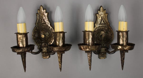 Vintage wall sconces with candle-style lights.