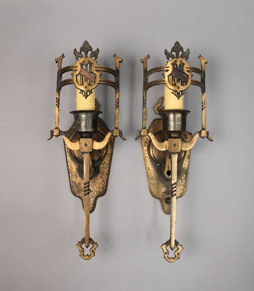 Vintage candle holders with decorative metalwork.