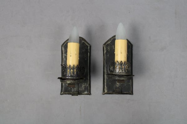 Vintage wall sconces with faux candles.