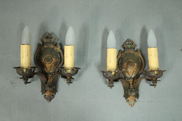 Vintage wall sconces with candle-like bulbs.