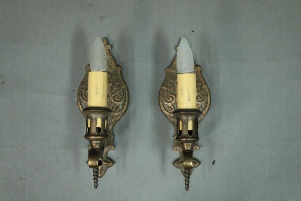 Vintage wall sconces with candle-like bulbs.