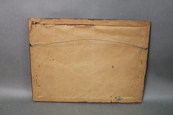 Back of a framed artwork with wire.