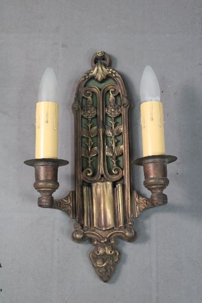 Vintage wall sconce with two candle lights.