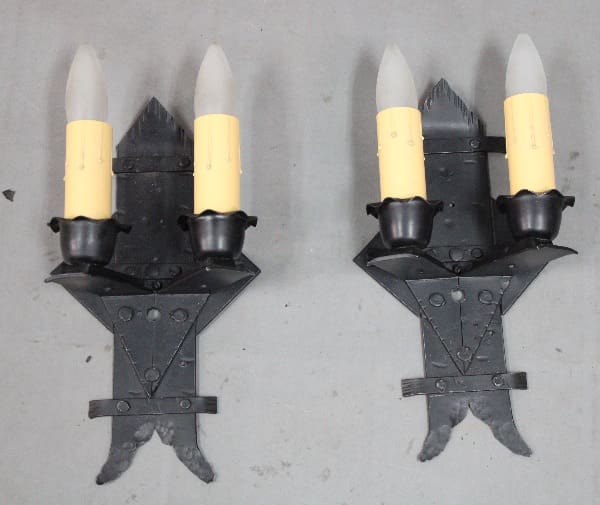 Wall sconces with candle-like lights.
