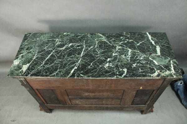 Wooden chest with green marble top.