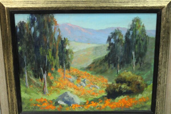 Landscape with flowers and distant mountains.