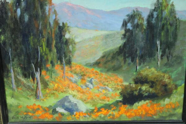 Vibrant landscape with orange flowers and trees.