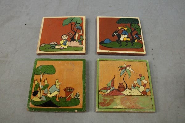 Four hand painted tile squares with scenes.