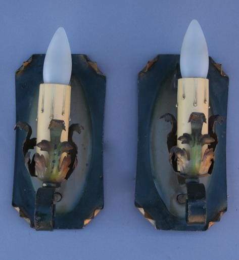 Vintage wall sconces with frosted bulbs.