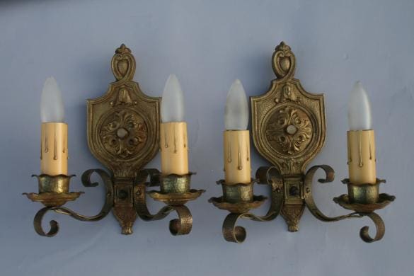 Vintage wall sconces with candle-like lights.