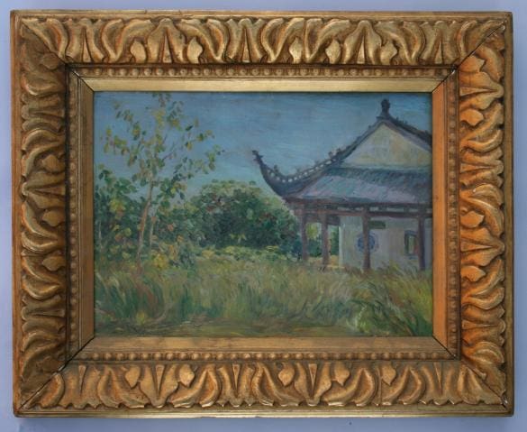 Framed painting of a serene landscape.