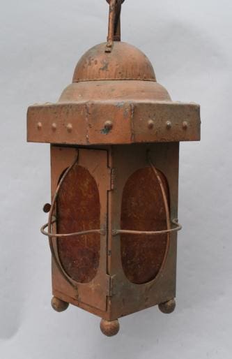Ornate copper hanging lantern with glass panels.