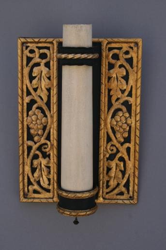 Ornate wall sconce with grapevine design.