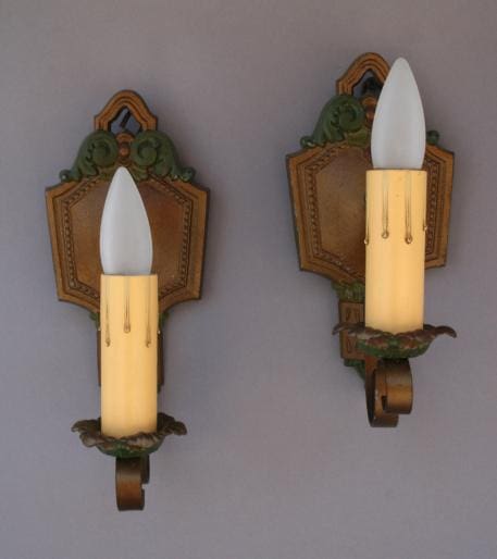 Vintage wall sconces with candle-like bulbs.