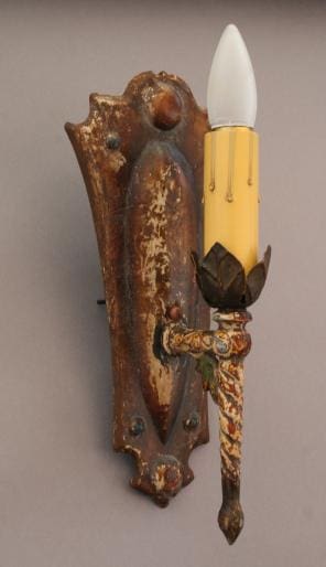 Vintage wall sconce with floral design.