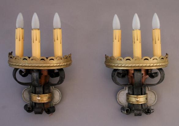 Wall sconces with decorative candle lights.