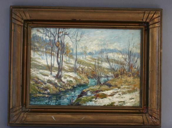 Snowy landscape with a winding stream.