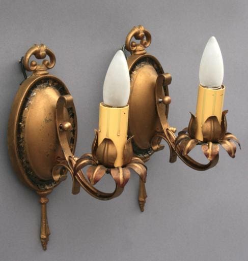 Vintage wall sconces with floral design.