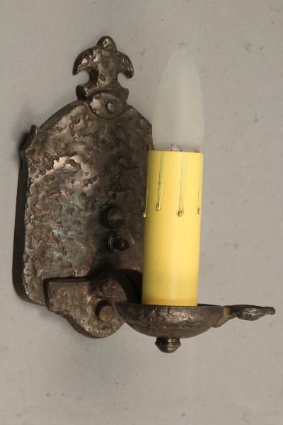 Vintage wall sconce with yellow candle light.