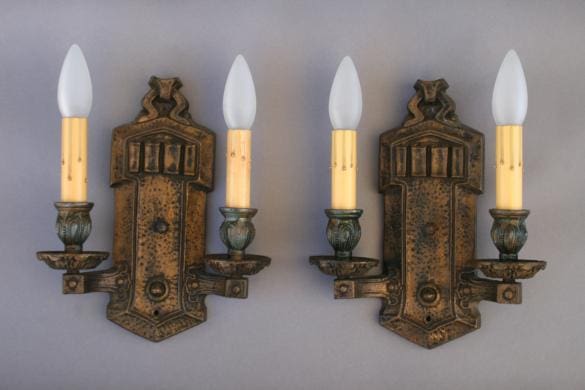 Vintage wall sconces with candle-style bulbs.