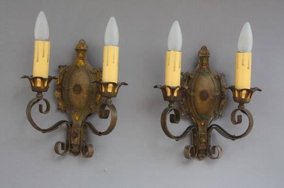 Vintage wall sconces with candle-like bulbs.
