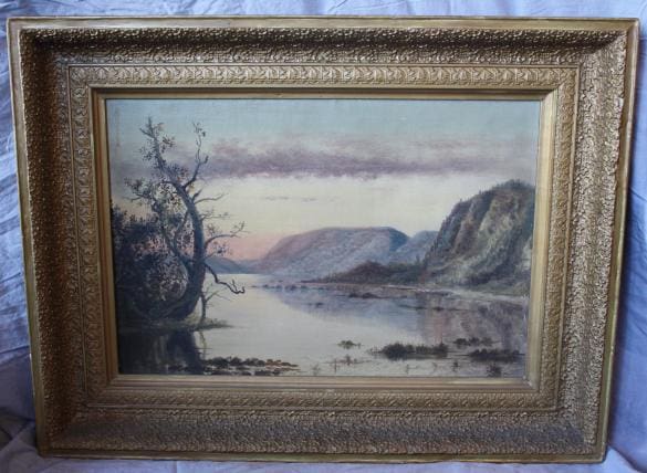 Landscape painting with framed water scene.