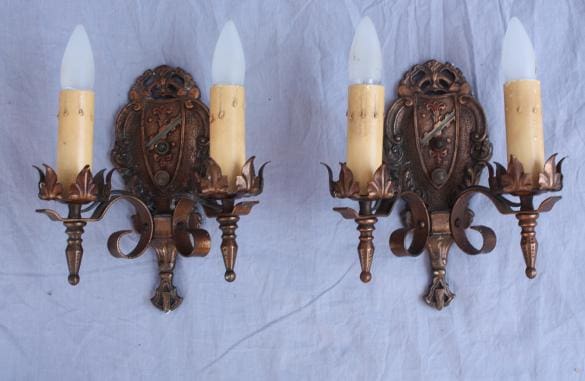 Vintage wall sconces with candle-like bulbs.