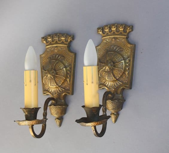Vintage wall sconces with candle-like bulbs.