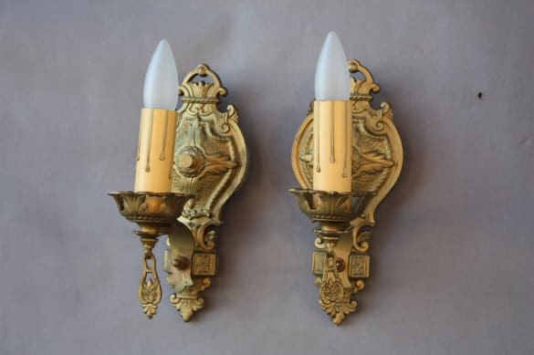Vintage decorative wall sconces with candles.