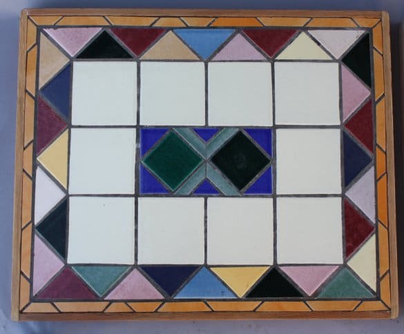 Colorful geometric tile pattern on a surface.