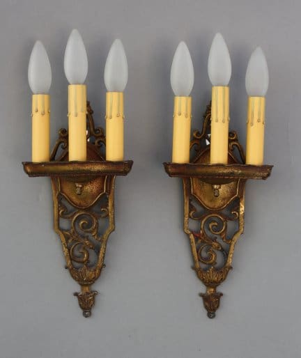 Vintage wall sconces with candle-like bulbs.