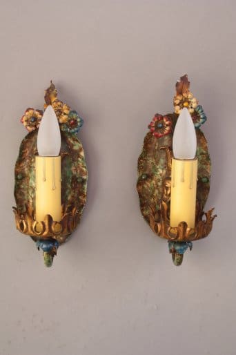 Vintage wall sconces with floral decorations.