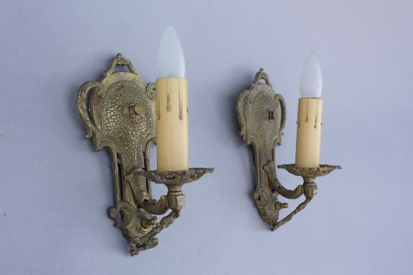 Vintage wall sconces with candle-like bulbs.