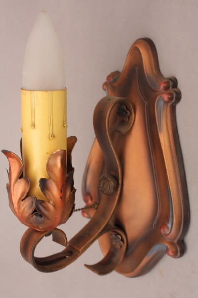Vintage wall sconce with floral design.