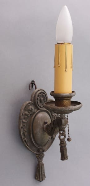 Antique wall sconce with candle light.