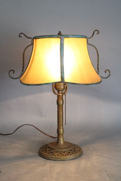 Vintage table lamp with yellow lampshade.